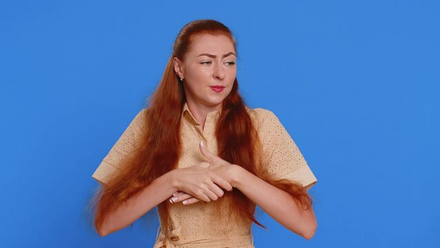 Stressed depressed young redhead woman terrified about danger problems, suffering phobia, anxiety disorder, expresses fear, waving no, insecure, stress, panic. Girl isolated on blue studio background