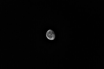 Stunning nighttime view of the moon in the dark sky