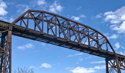 tall railway trestle bridge over the rondout creek in kingston new york (train tracks high up)