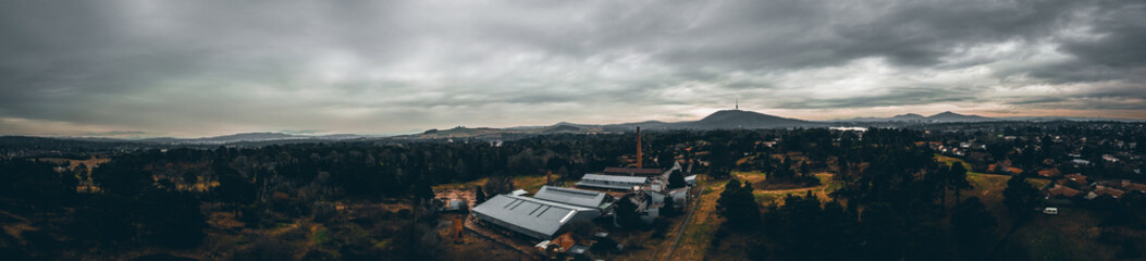Panoramic shot of a country landscape under a gloomy sky