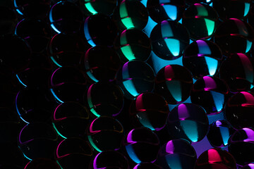 High angle shot of Water Beads staged in colorful light in close-up