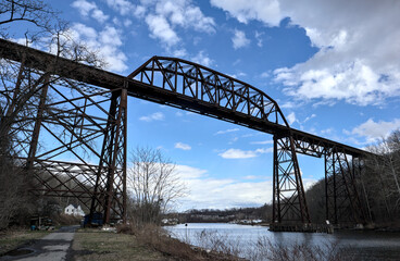 tall railway trestle bridge over the rondout creek in kingston new york (train tracks high up)