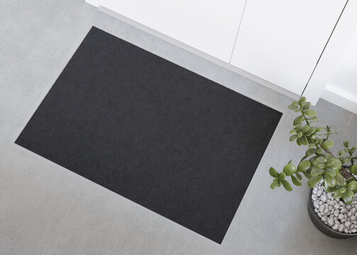 Sleek black doormat mockup in a contemporary setting, perfect for displaying logos or custom prints in a home or office entrance. Welcome mat with copy space. Doormat mock up. Carpet at entrance. 3D.