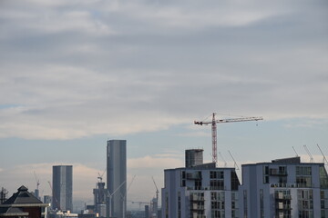 Obraz premium Aerial view of modern buildings with cranes on London