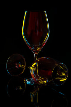 White Wine Glass silhouette over Black Background.