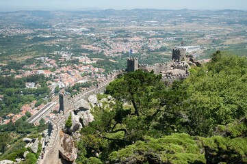 Scenic view of a majestic mountain top from the viewpoint of a tall tower in Sintra.