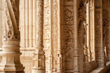 Ornate columns and statues of the Jeronimos Monastery in Portugal.