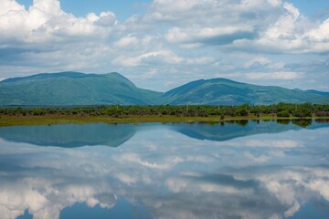 Flooded field in Plitvice Lakes National Park, Croatia, with the reflection in the water.