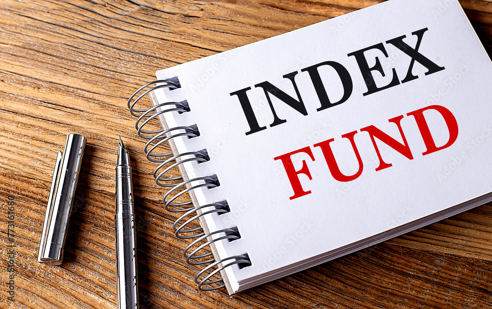 Poster index fund text on notebook with pen on the wooden background