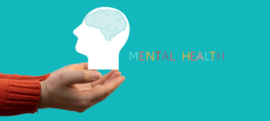 Mental health awareness, human hand care and support hold white paper head and glowing brain with physical and mental health, wellbeing, brain health, psychological support, healthcare and mindfulness