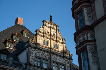 Town hall of the city of Altenburg in Thuringia. Half-timbered house from the Renaissance. Facade on the market square in Altenburg. - obrazy, fototapety, plakaty