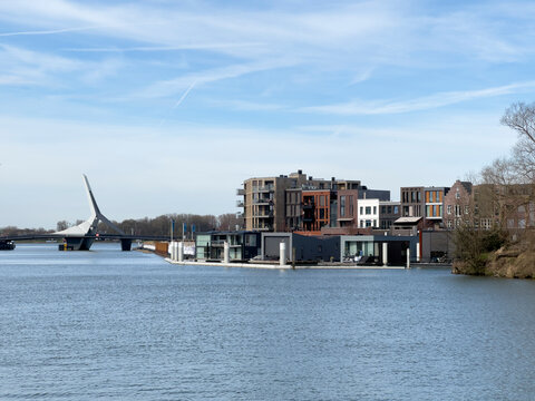 Picturesque vista unfolds over the river, capturing the Prins Clausbrug bridge and the burgeoning housing development of Stadswerven in Dordrecht.