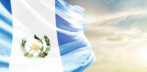 Guatemala national flag waving in the sky.