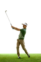 Action shot of man, golf player in cap and shirt playing golf, swinging ball in motion against...
