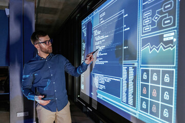 Business coach against projector with data
