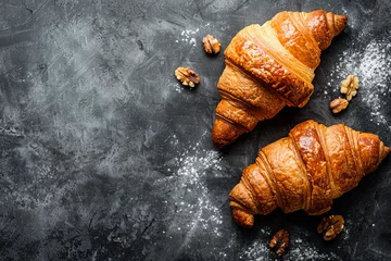 Fotobehang Delicious fresh, crispy French croissants with sweet filling on a dark concrete background © Fabio