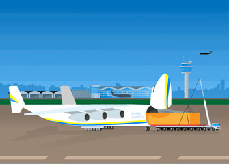 Um avião de carga gigante sendo descarregado em um aeroporto. Cores da Ucrânia. Grua.