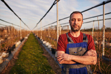 Portrait of a farmer in a blueberries organic farm.