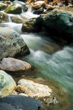 Long exposure image of stream water with rocks