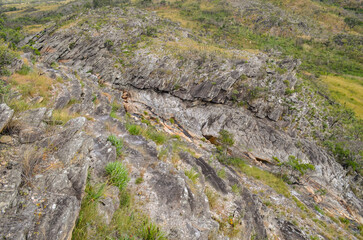 Beautiful waterfall sliding down the rock wall in Serra do Espinhaço in Minas Gerais, Brazil