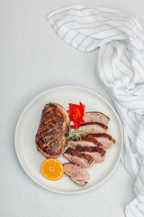 Fried duck breast with fresh orange and ginger, ready to eat food. Domestic cuisine, poultry meat