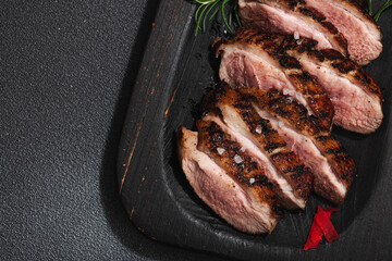 Fried duck breast with fresh orange and ginger, ready to eat food. Domestic cuisine, poultry meat