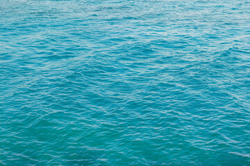 Sea background. Turquoise blue water surface texture