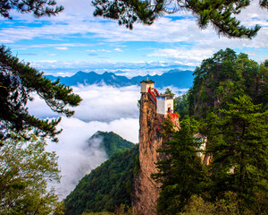 Taoist temple on cliff with sea of clouds - obrazy, fototapety, plakaty