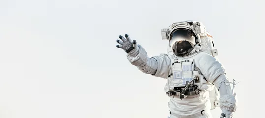 Rolgordijnen An astronaut reaching out towards the viewer against a clear sky backdrop, symbolizing connection and exploration © Fxquadro