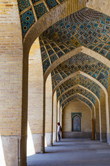 Unidentified people visiting the brilliant brick works of a Mosque in Shiraz, Iran. Perfect...