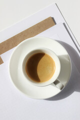 Cup of Espresso on Office Desk at Business Meeting. Morning Coffee at Work.