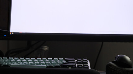 a computer mouse and keyboard infront on an lcd screen
