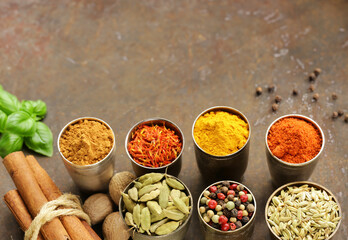 various types of spices on wooden background