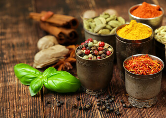 various types of spices on wooden background