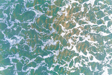 close up top view of the texture of the seawater on the shore, background water sea natural view