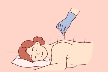 Acupuncture procedure from traditional chinese medicine for woman lying at reception in SPA center. Process of acupuncture and needle therapy allows you to get rid of pain in spine after injury