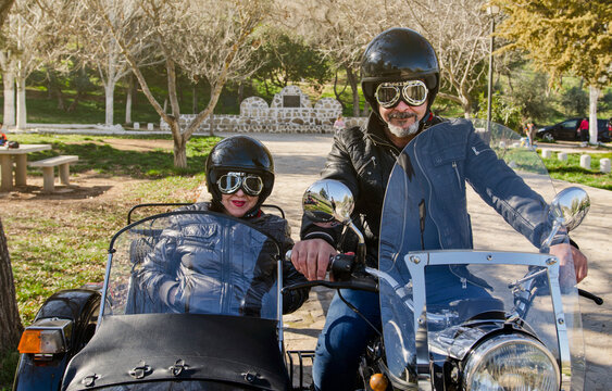Senior couple at sidecar bike