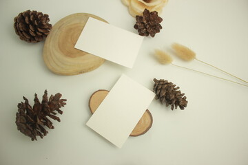Blank paper for mockup business card decoration on a wooden background