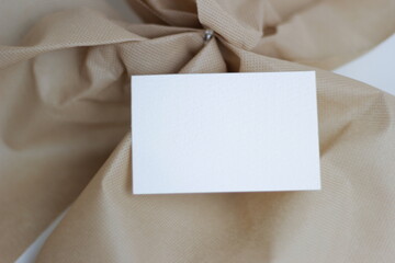 Blank paper for mockup business card decoration on a wooden background