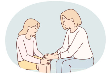 Mom holds hand of sad teenager daughter helps to get rid stress and consoles after quarrel