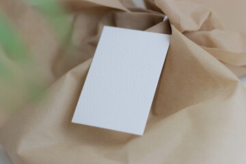 Blank paper for mockup business card decoration on a wooden background