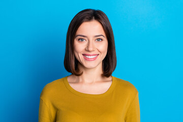 Photo of pretty cheerful lady dressed shirt smiling showing white teeth isolated blue color background