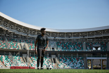 Obraz premium African American soccer player during match inside large stadium