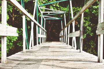 Wooden bridge with green metal railings, wooden walkway, closeup, nature photography, aesthetic 