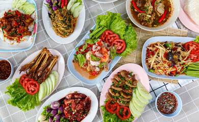 Traditional northeastern Thailand floods, Many variety various Isaan foods on a table.