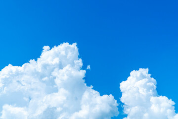 Bright Large white cumulus clouds with blue sky background. Big clear cumulus clouds and blue sky texture
