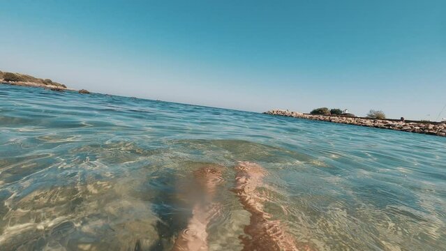 person swimming in sea, travel and tropical holiday, summer vacation or adventure. Floating fins, diver and closeup of ocean water, snorkler watersport or tourist