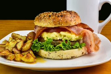 Foto auf Acrylglas scramble egg sausage bagel breakfast sandwich © dmiller324