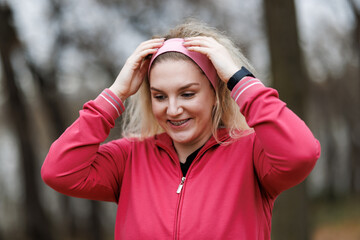 Woman Taking a Break During Outdoor Winter Jog in Park