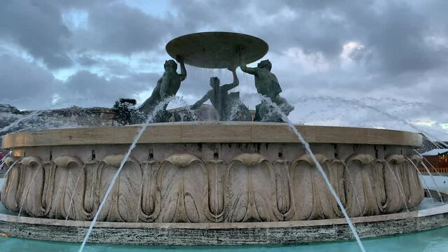 The Tritons&rsquo; Fountain at Valletta city centre.  Running water. Fountain is located on square outside the City Gate. Three bronze Tritons holds a large basin. Valletta, Malta